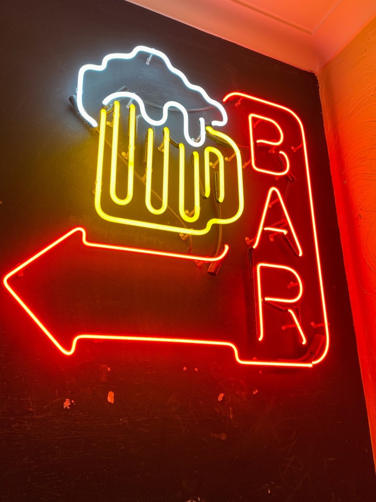 Neon sign on a wall on the way in to Nameless bar in Sydney.